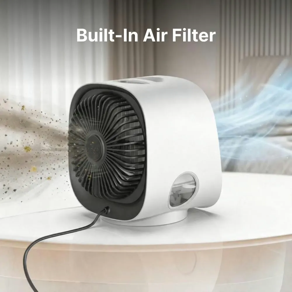 Side view of the AiraBreeze portable air cooler on a table, its built-in air filter drawing in airborne dust and releasing a stream of clean, cool air